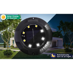 Zestaw 4 czarnych lamp solarnych wbijanych do ziemi z widocznym panelem i diodami LED