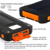 Power bank solarny czarno-pomarańczowy z panelem słonecznym i białym kablem USB