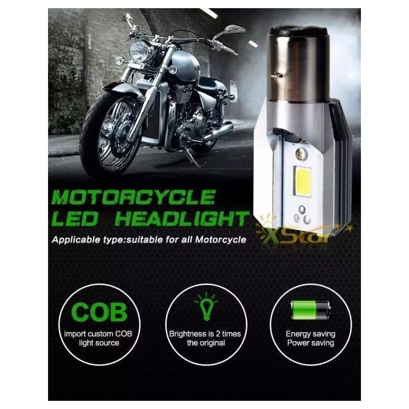 Żarówka LED 6W z trzonkiem BA20 D obok motocykla w ciemnym garażu