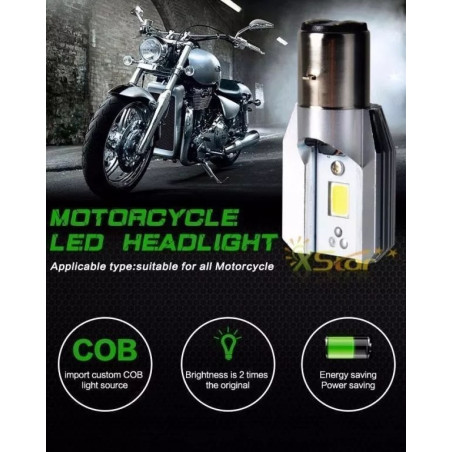 Żarówka LED 6W z trzonkiem BA20 D obok motocykla w ciemnym garażu