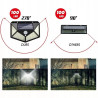 czarna lampa solarna LED z panelem i czujnikami ruchu oraz zmierzchu zamontowana na ścianie
