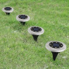 Cztery okrągłe lampy solarne LED z metalową ramą i szpikulcem do wbicia w ziemię