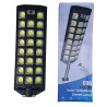 Czarna lampa solarna LED z panelem słonecznym, czujnikiem ruchu i pilotem