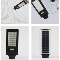 Czarna latarnia solarna LED z panelem solarnym i czujnikiem ruchu zamontowana na białym uchwycie rurowym