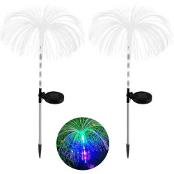 Dwie lampy solarne w kształcie palm z kolorowym światłem LED wieczorem