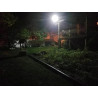Czarna latarnia solarna LED SMD 850W z panelem solarnym i czujnikiem ruchu